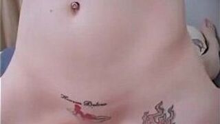 Tattooed brunette rides cock - porn video